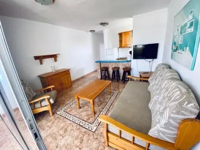 Una televisión o centro de entretenimiento en Apartamentos Sandra