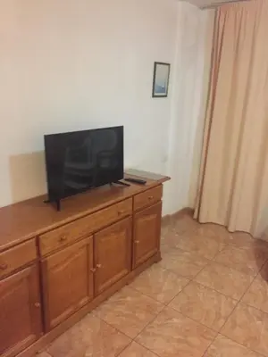 Una televisión o centro de entretenimiento en Apartment Yumbo Centrum