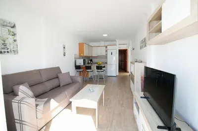 Una televisión o centro de entretenimiento en Las Cascadas Puerto de Mogán II