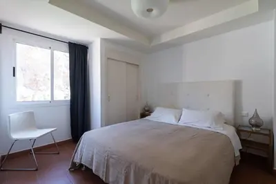 Cama o camas de una habitación en Gran terraza con vistas al mar
