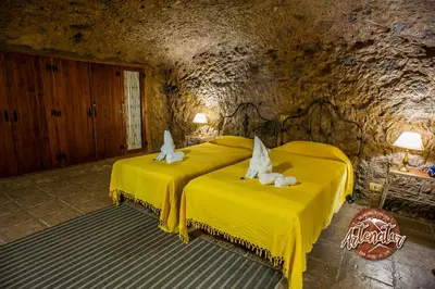 Cama o camas de una habitación en Casa Cueva El Mimo By Artenatur