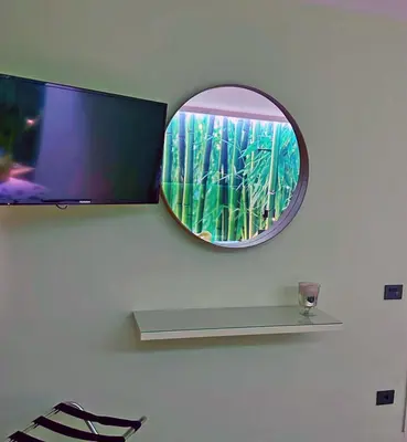 Una televisión o centro de entretenimiento en Apartamentos Portonovo