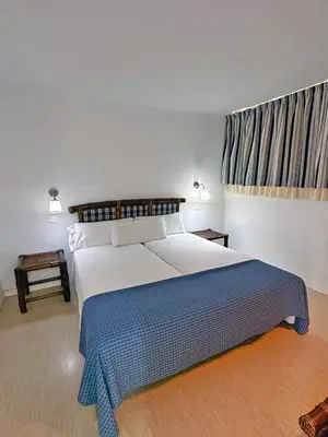 Cama o camas de una habitación en Apartamentos Portonovo