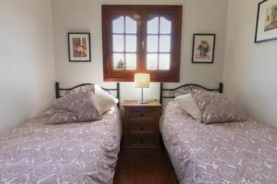 Cama o camas de una habitación en El Cañaveral – Casa Rural con Terraza San Mateo