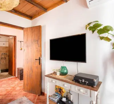 Una televisión o centro de entretenimiento en Casa Fuente Hervera