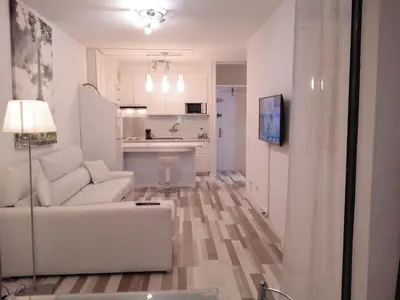 Una televisión o centro de entretenimiento en Apartamentos Iguazu - Yumbo