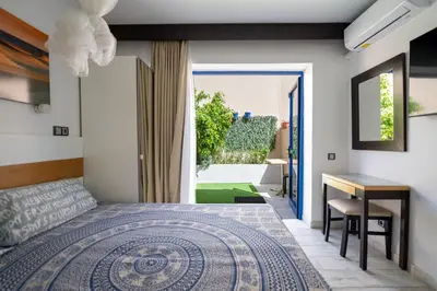 Cama o camas de una habitación en Apartamentos Playa Feliz