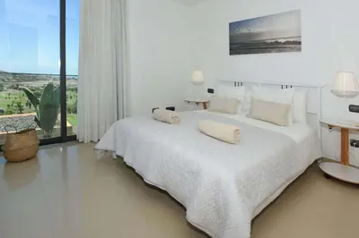 Cama o camas de una habitación en Salobre Los Lagos 26