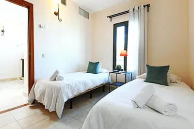 Cama o camas de una habitación en Salobre Morro Golf 7