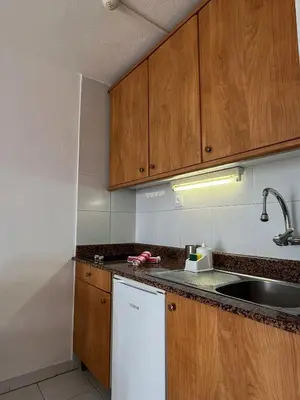 Una cocina o zona de cocina en The Mayfair Village apto 305