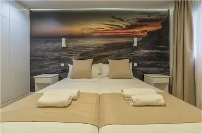 Cama o camas de una habitación en Hotel Ciudad del Mar