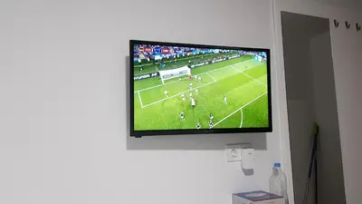 Una televisión o centro de entretenimiento en Apartamento muelle
