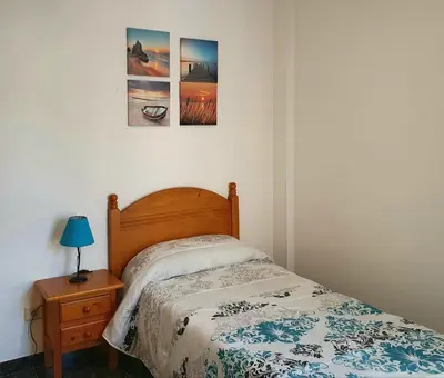Cama o camas de una habitación en Vivienda FRALEMAR Arinaga.