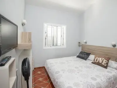 Cama o camas de una habitación en GuestReady - Los Arcos 174 - FC