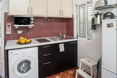 Una cocina o zona de cocina en GuestReady - Los Arcos 174 - FC