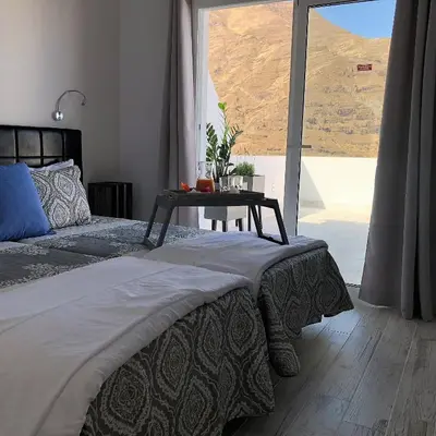 Cama o camas de una habitación en La Casita de Juani,La Suerte