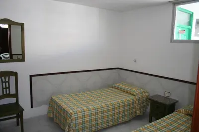 Cama o camas de una habitación en Apartamentos Maba Playa