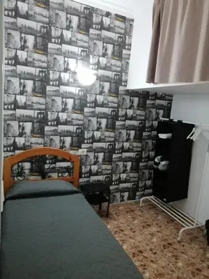 Cama o camas de una habitación en Alcaravaneras Hostel