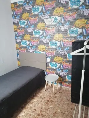 Cama o camas de una habitación en Alcaravaneras Hostel