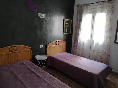 Cama o camas de una habitación en Alcaravaneras Hostel