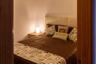 Cama o camas de una habitación en Apartamento a pie de playa