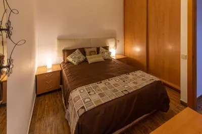 Cama o camas de una habitación en Apartamento a pie de playa