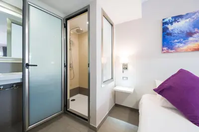 Cama o camas de una habitación en eó Corona Cedral