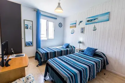 Cama o camas de una habitación en La Jacaranda