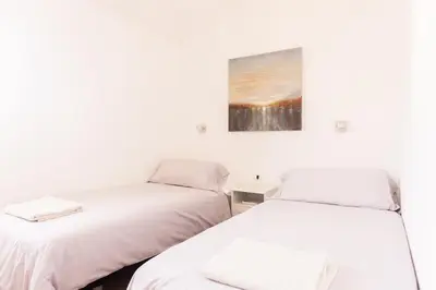 Cama o camas de una habitación en Maravilloso Duplex en San Agustin