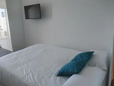 Cama o camas de una habitación en Vivelorural estudio Las Canteras vista mar- 307