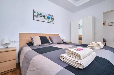 Cama o camas de una habitación en Apartments Vegueta Suite