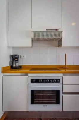 Una cocina o zona de cocina en ESPECTACULAR ATICO CON TERRAZA A 50 MT PLAYA CANTERAS
