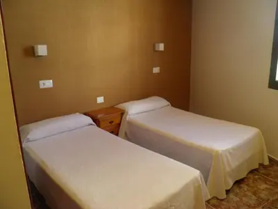 Cama o camas de una habitación en Hostal Albacar
