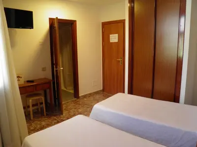 Cama o camas de una habitación en Hostal Albacar