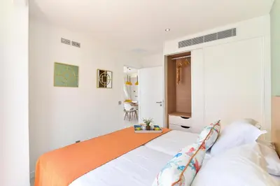 Cama o camas de una habitación en Mogan Beachfront apartment V&L by VillaGranCanaria