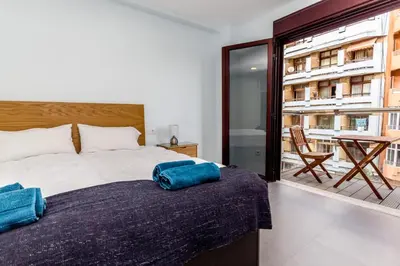 Cama o camas de una habitación en Canteras Luxury Beach Apartments