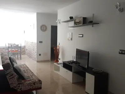 Una televisión o centro de entretenimiento en Apartment Pitaya