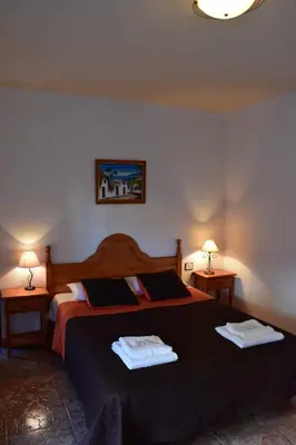 Cama o camas de una habitación en La Fonda Aeropuerto