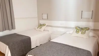 Cama o camas de una habitación en Apartamentos Horizonte