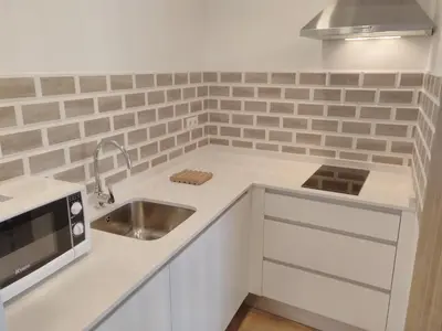 Una cocina o zona de cocina en Apartamentos Ciudad Jardín