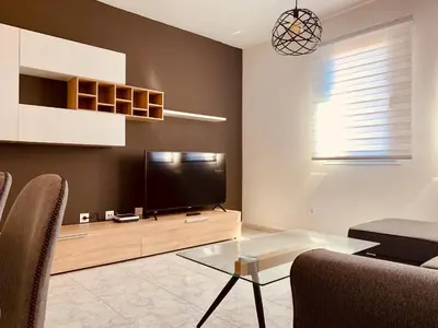Una televisión o centro de entretenimiento en A&F Comfort Modern House