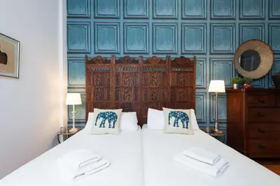 Cama o camas de una habitación en Apartamentos Vegueta