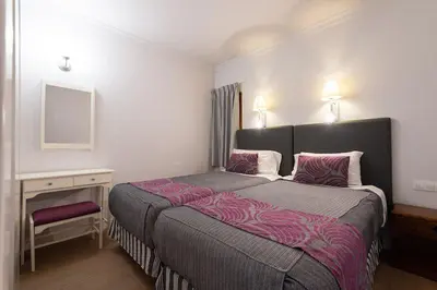 Cama o camas de una habitación en TC Apartamentos Don Diego