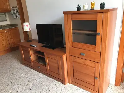 Una televisión o centro de entretenimiento en Apartment 3 minutes from Puerto Rico beach