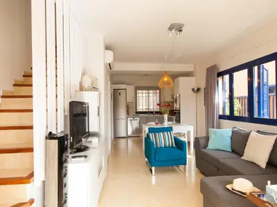 Zona de estar de Casas Meloneras by VillaGranCanaria