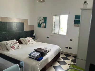 Cama o camas de una habitación en NATURAL CONFITAL BEACH