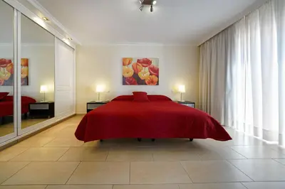 Cama o camas de una habitación en Bungalow Hibiscus San Agustin