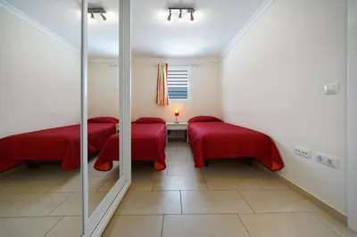 Cama o camas de una habitación en Bungalow Hibiscus San Agustin