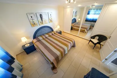 Cama o camas de una habitación en Bungalow Hibiscus San Agustin