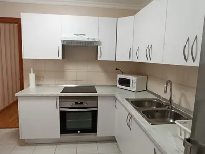 Una cocina o zona de cocina en Noelia La Garita Beach y disfruta de tus vacaciones